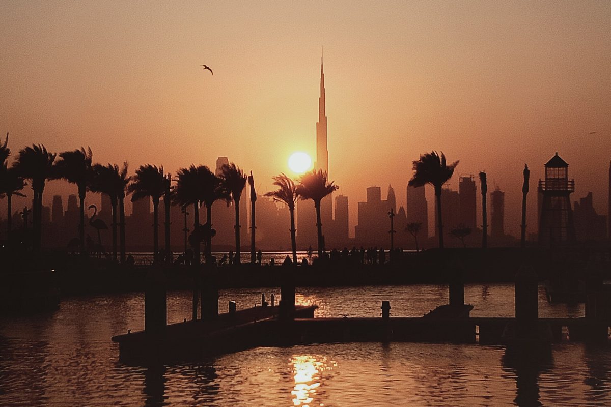 Sunset over Dubai with palm trees