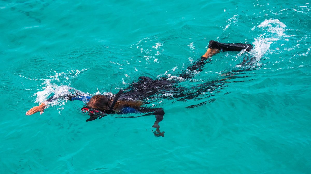 Snorkeling in crystal-clear turquoise water